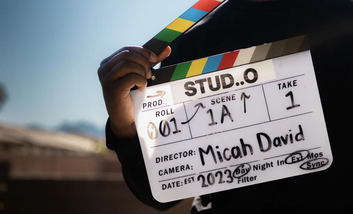 A film slate marked STUDiiO, director Micah David, on set in Las Vegas